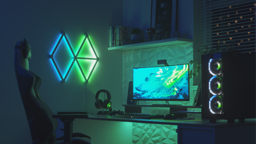 This is an image of a chill modern living room with Nanoleaf Canvas light squares behind the couch. The color changing RGB panels come in over 16 million bright and vibrant colors and are fully customizable with it's modular layout. The perfect living room lights for setting the vibe.